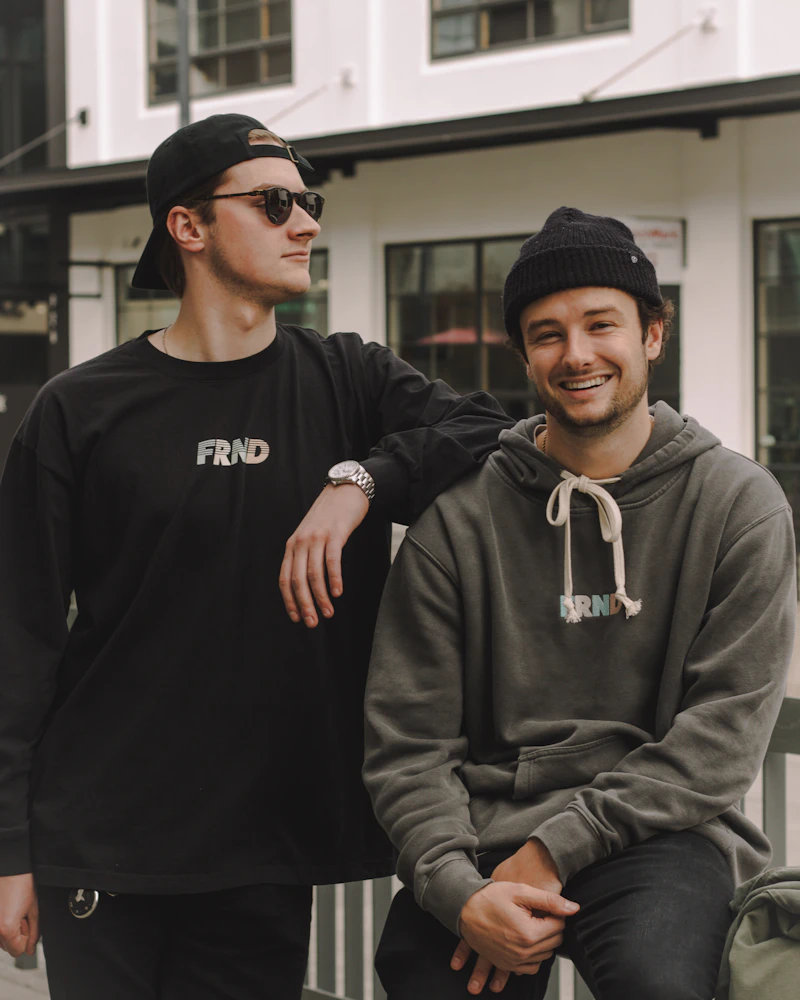 Two friends in hoodies and tees