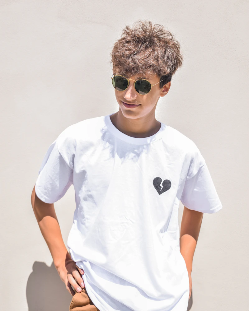 Young man in a white tee and sunglasses